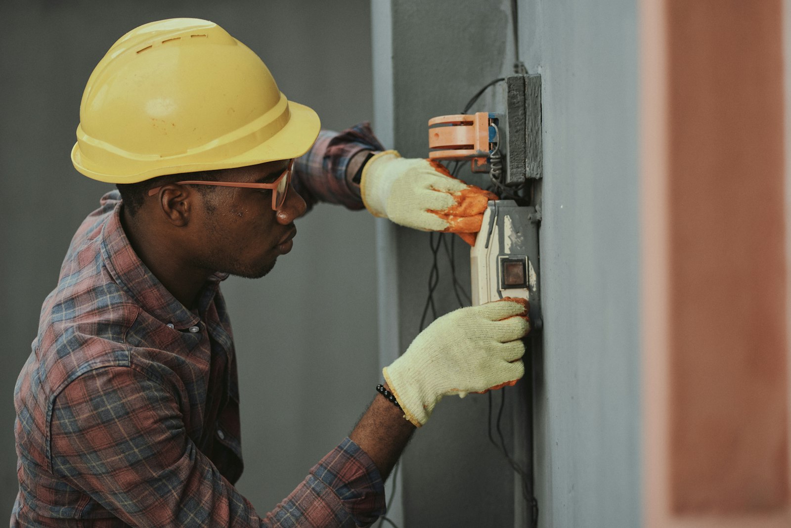 Electrician at a commercial switchboard